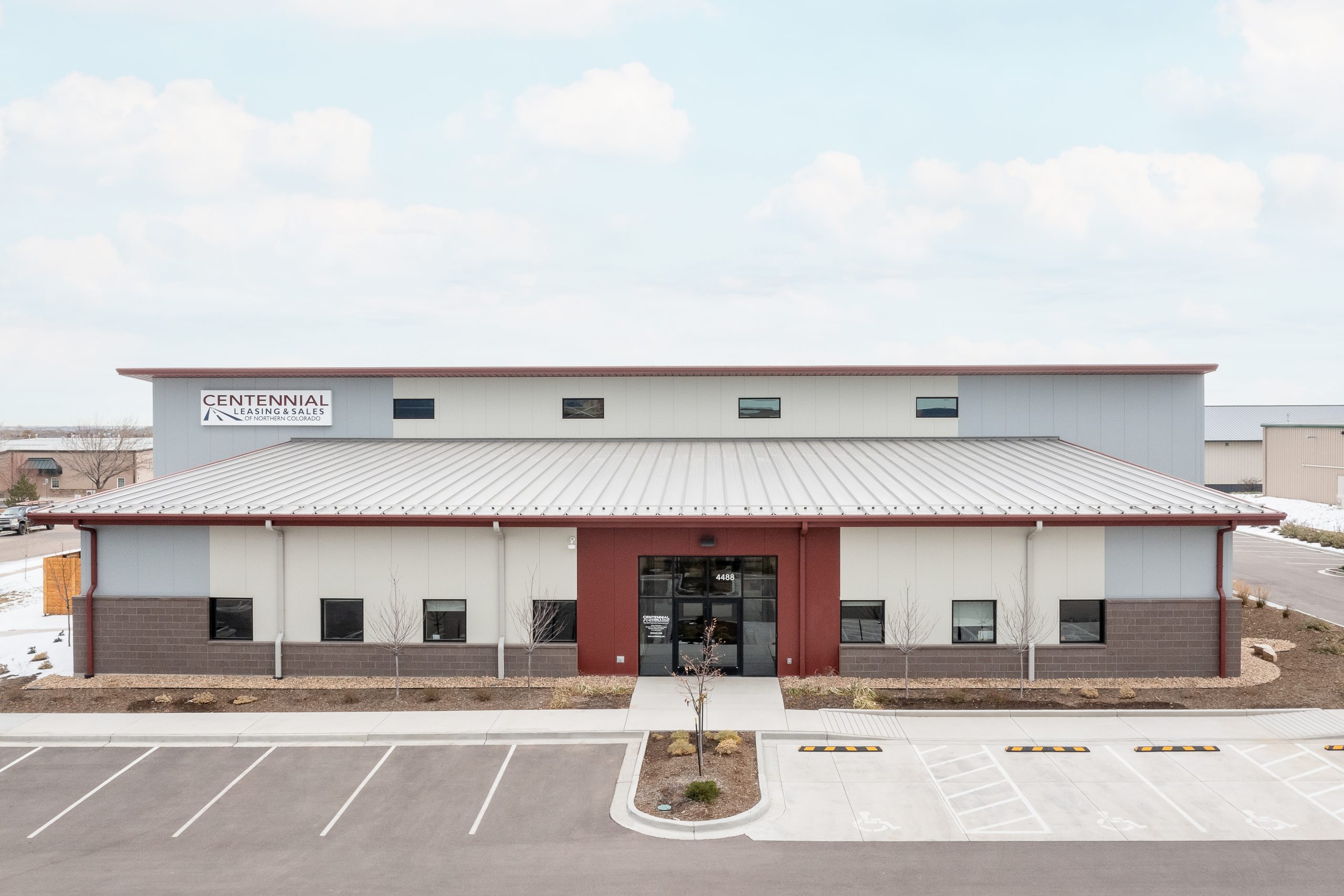 exterior of auto broker building under blue skies